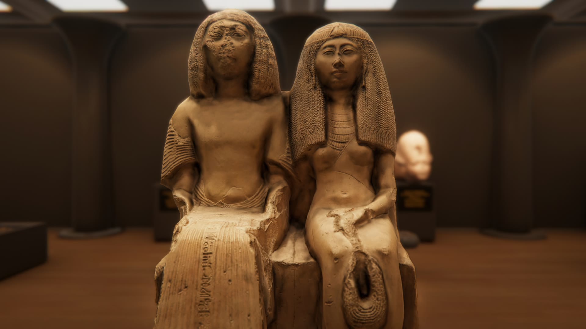 Seated pair statue